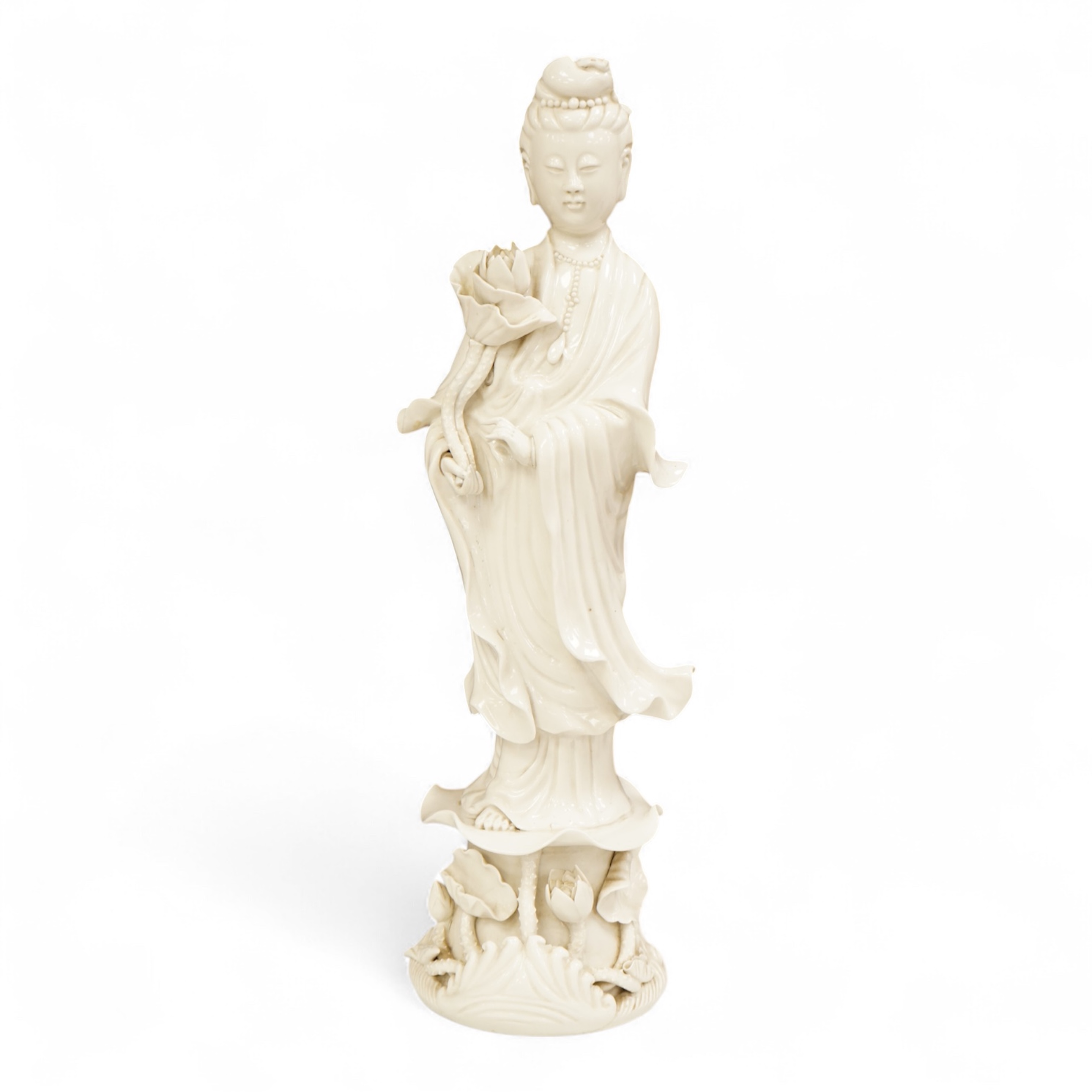 A Chinese blanc de chine figure of Guanyin, 42cm high